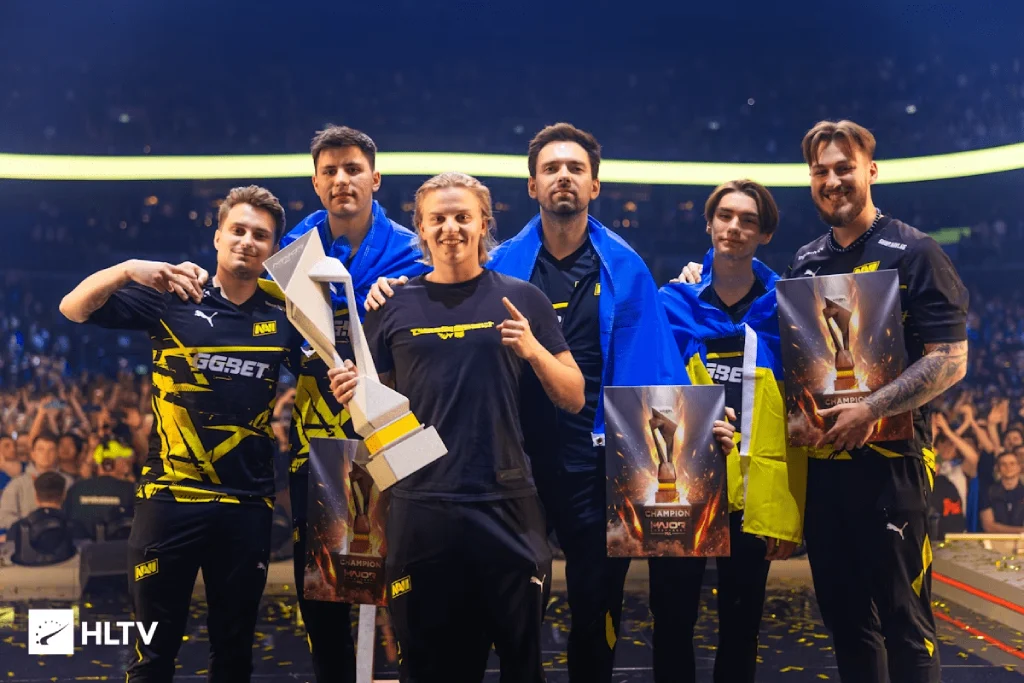 NAVI celebrating victory at PGL Major Copenhagen 2024 with trophy and champion posters